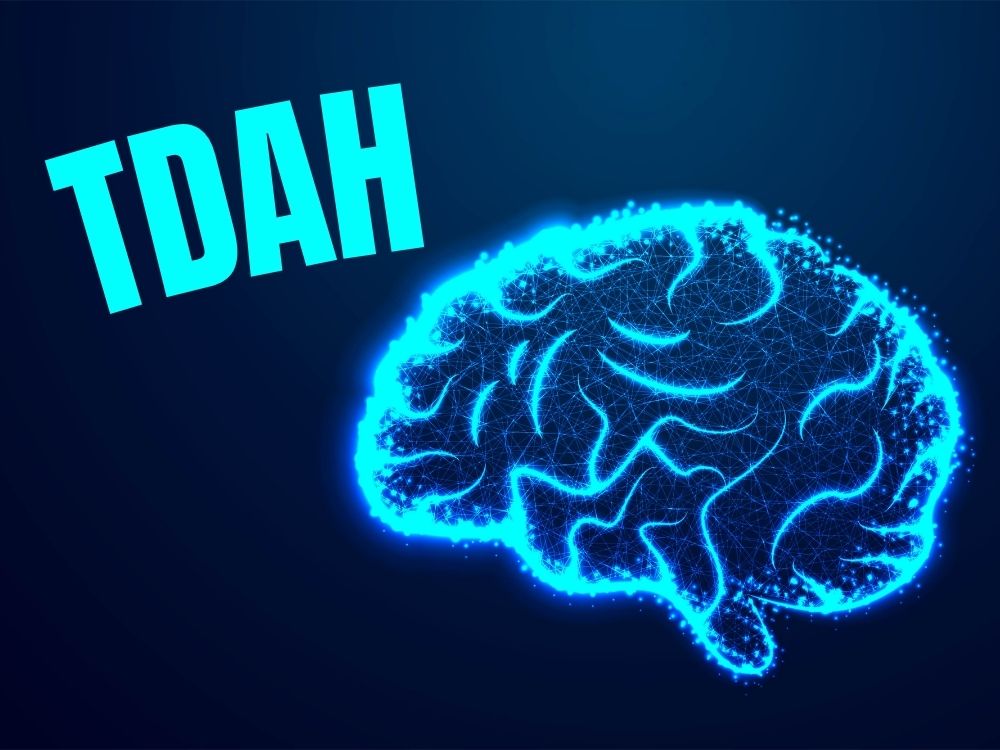 Image illustrant un cerveau lumineux avec le texte "TDAH"